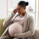 Douleurs au bas-ventre à 4 mois de grossesse : faut-il s’inquiéter ?